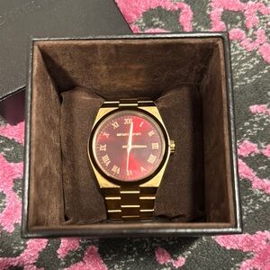Michael Kors Gold and Red Analog Watch with Luxurious Metal Band